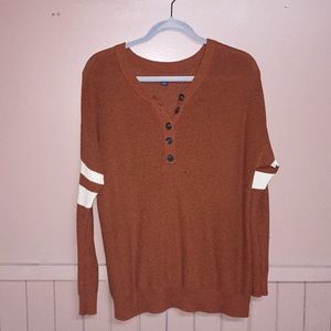 Rusty orange long sleeve sweater.